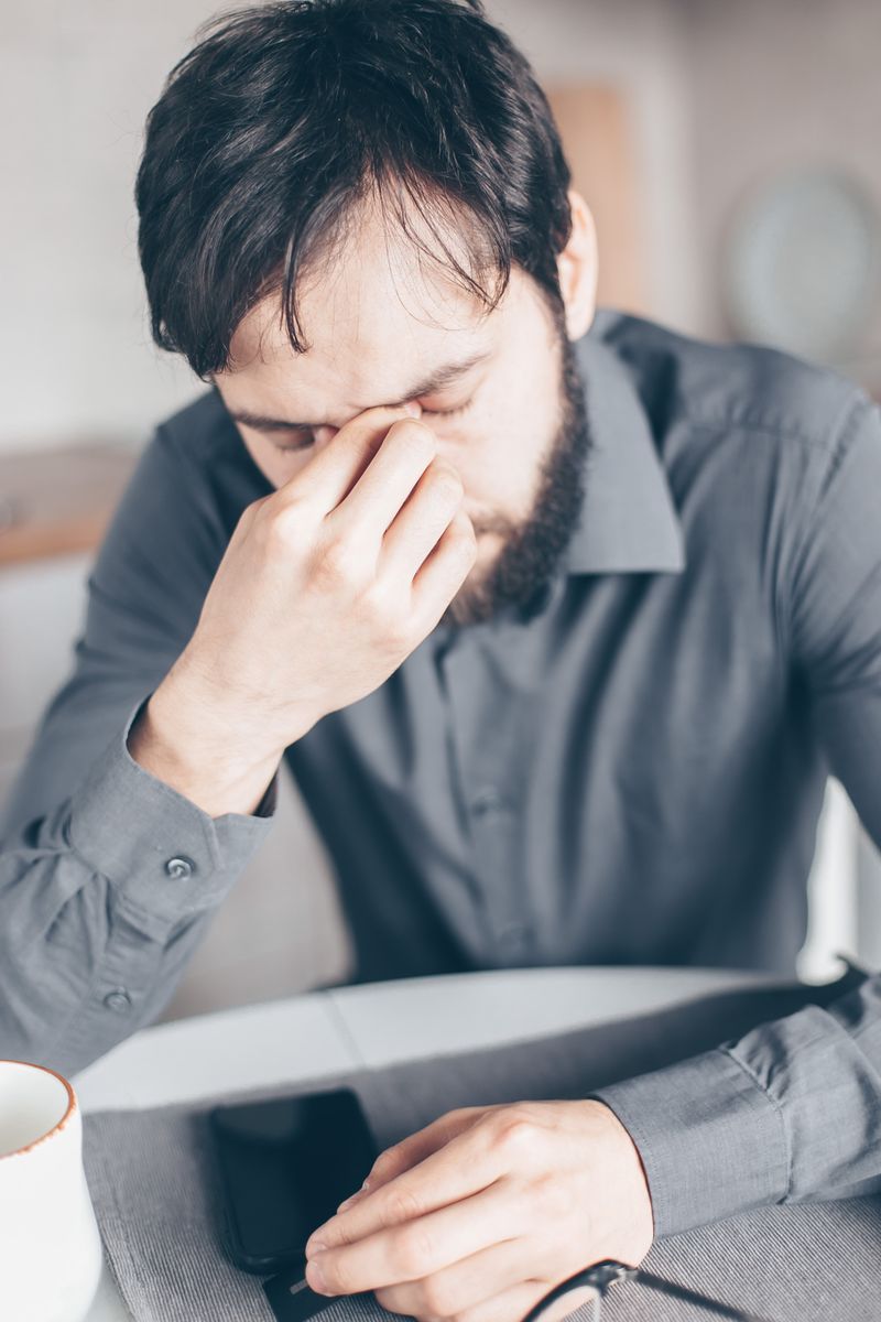 Exhausted professional at desk - the operator's trap